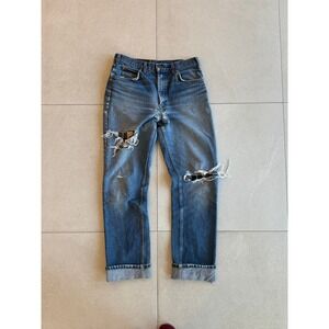 Vintage Levis 619 Orange Tab thrashed and repaired jeans